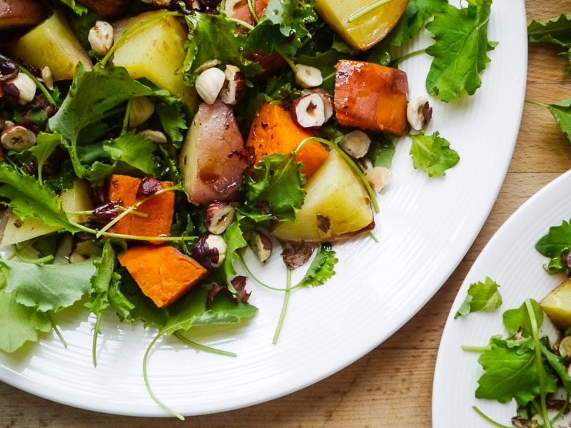 When you can't decide between potato and sweet potato, the answer is to clearly have a little bit of both. They pair perfectly with crunchy hazelnuts and a zesty, lemon-infused dressing in this recipe.