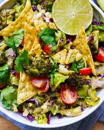 Vegan friendly Roasted Broccoli and Guacamole Salad | wordpress-6440-15949-223058.cloudwaysapps.com | all the goodness of a big green salad mixed with lots of avocado and lime, so easy and delicious!