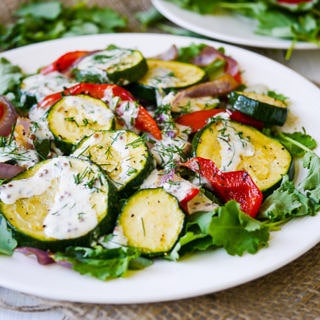 Roasted Zucchini Salad with Yoghurt Dill Dressing - This healthy roasted zucchini salad recipe is quick and easy to prepare. Gluten free & grain free, topped with a creamy yoghurt-dill dressing! Recipe via wordpress-6440-15949-223058.cloudwaysapps.com