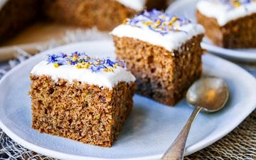 This gluten free zucchini cake recipe combines ground roasted hazelnuts, oats and buckwheat to make a healthier cake that's soft and delicious! Recipe via wordpress-6440-15949-223058.cloudwaysapps.com
