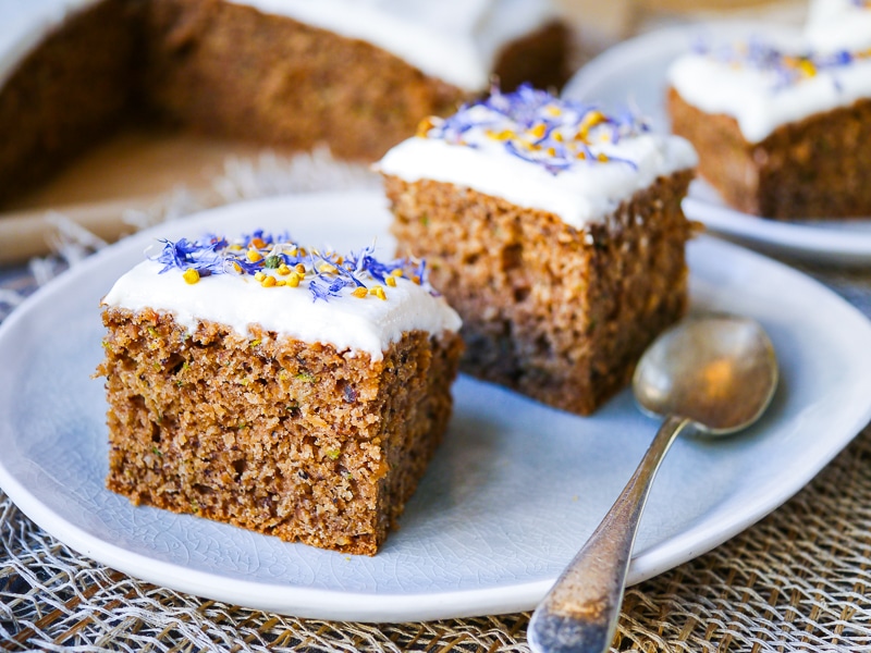This gluten free zucchini cake recipe combines ground roasted hazelnuts, oats and buckwheat to make a healthier cake that's soft and delicious! Recipe via wordpress-6440-15949-223058.cloudwaysapps.com