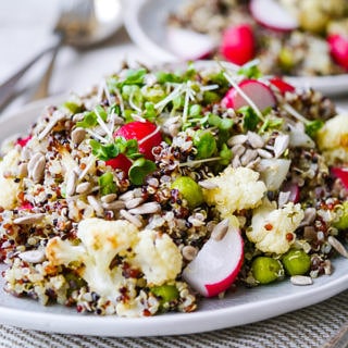 This gorgeous pea and cauliflower quinoa pilaf is packed full of healthy vegetables. Vegan, gluten free and sugar free. The perfect side dish! Recipe via wordpress-6440-15949-223058.cloudwaysapps.com