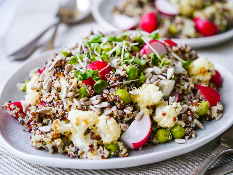 This gorgeous pea and cauliflower quinoa pilaf is packed full of healthy vegetables. Vegan, gluten free and sugar free. The perfect side dish!