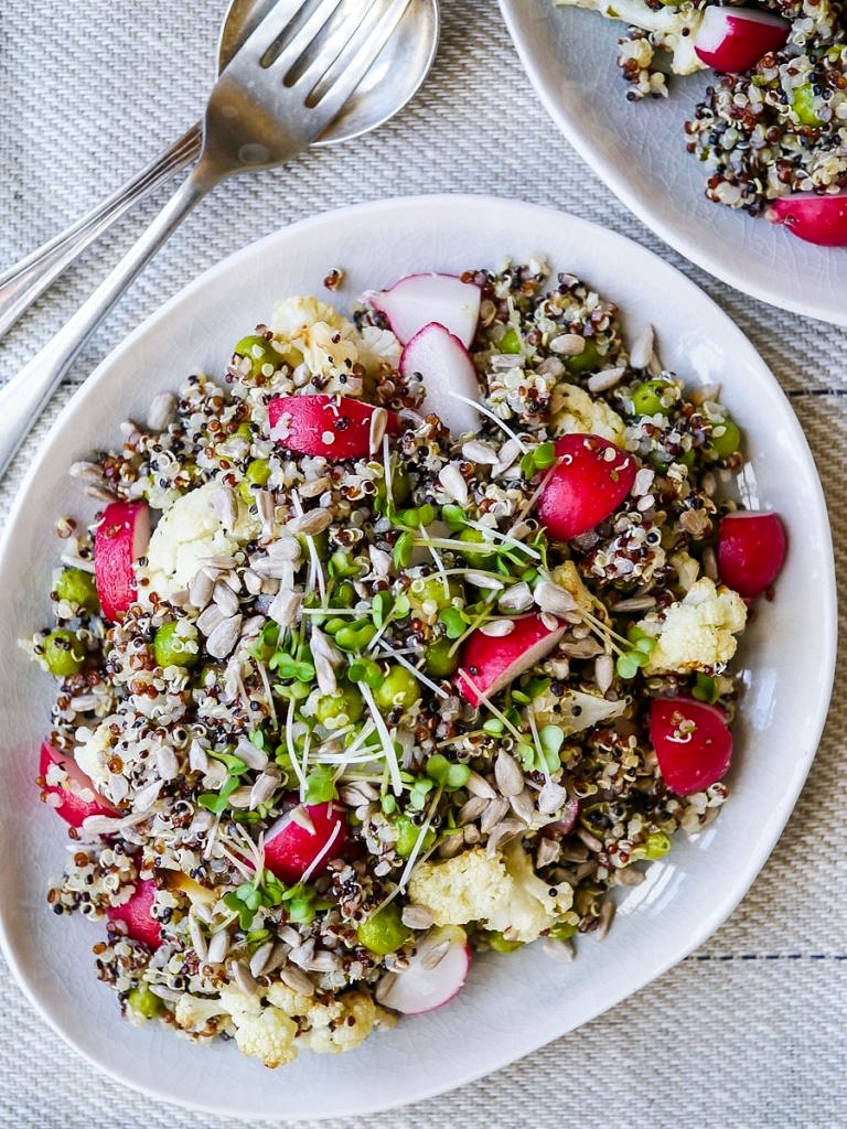 This gorgeous pea and cauliflower quinoa pilaf is full of nourishing vegetables. Vegan, gluten free and sugar free. It makes a great side dish and is also perfect for packing for a healthy lunch!