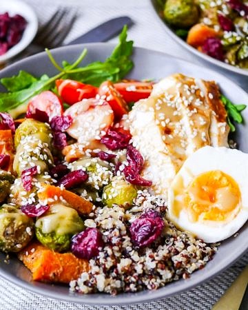 A Maple Tahini Brussels Sprouts Quinoa Bowl packed with healthy vegetable goodness! Dairy free, gluten free & nut free, with a vegan or vegetarian option. Recipe via wordpress-6440-15949-223058.cloudwaysapps.com