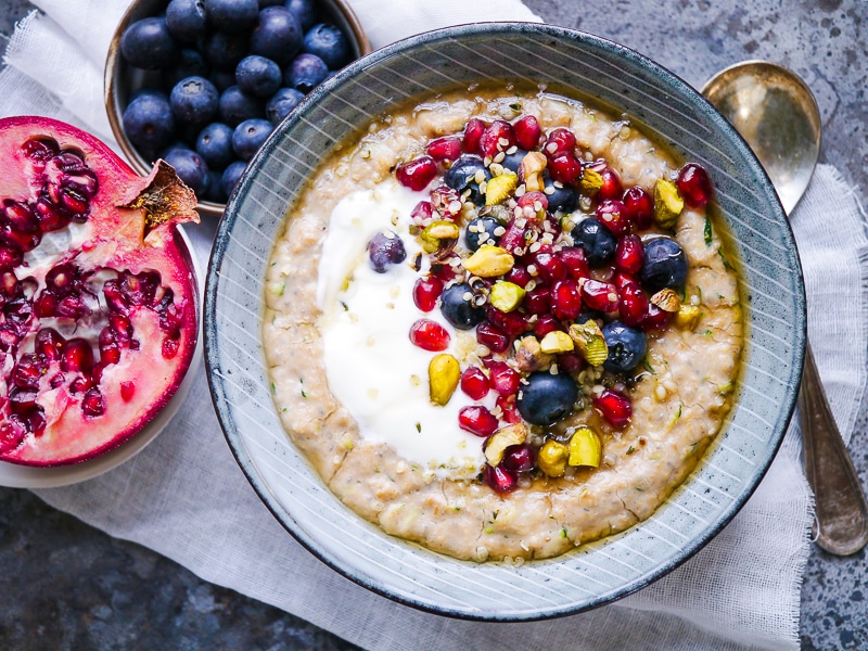Oat and Zucchini Protein Porridge made with gluten free rolled oats, grated zucchini and vanilla protein powder. A healthy breakfast bowl to start your day right!