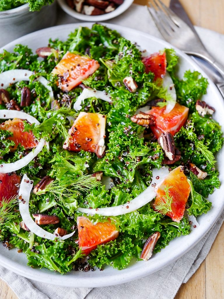 A vibrant, healthy massaged kale and blood orange salad. Finished with crunchy pecans! Gluten free, dairy free and vegan friendly