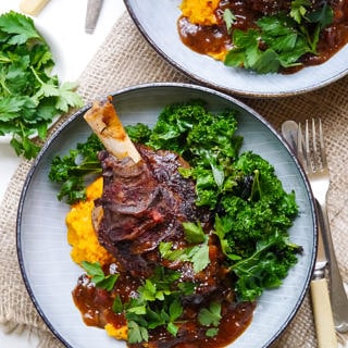 Balsamic slow cooker lamb shanks made with dried thyme and a rich flavoursome tomato sauce. Gluten free, dairy free and really easy to make! Recipe at wordpress-6440-15949-223058.cloudwaysapps.com