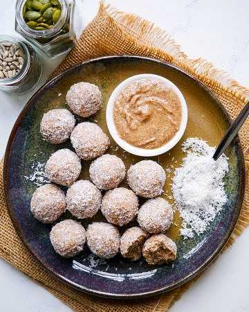 No Food Processor Protein Balls arranged on a blue ceramic plate