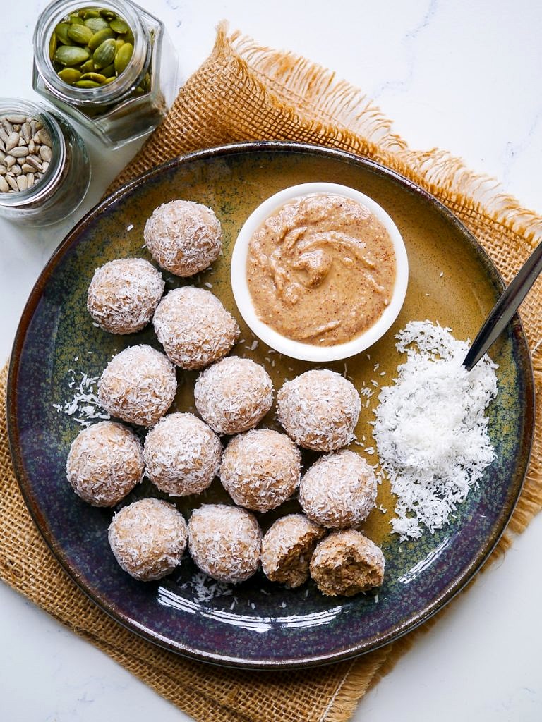 No Food Processor Protein Balls arranged on a blue ceramic plate