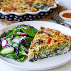 This pesto vegetable frittata makes an easy, healthy meal that can be made ahead of time. Gluten free and grain free, a simple delicious way to get in your veggies! Recipe by Nourish Everyday