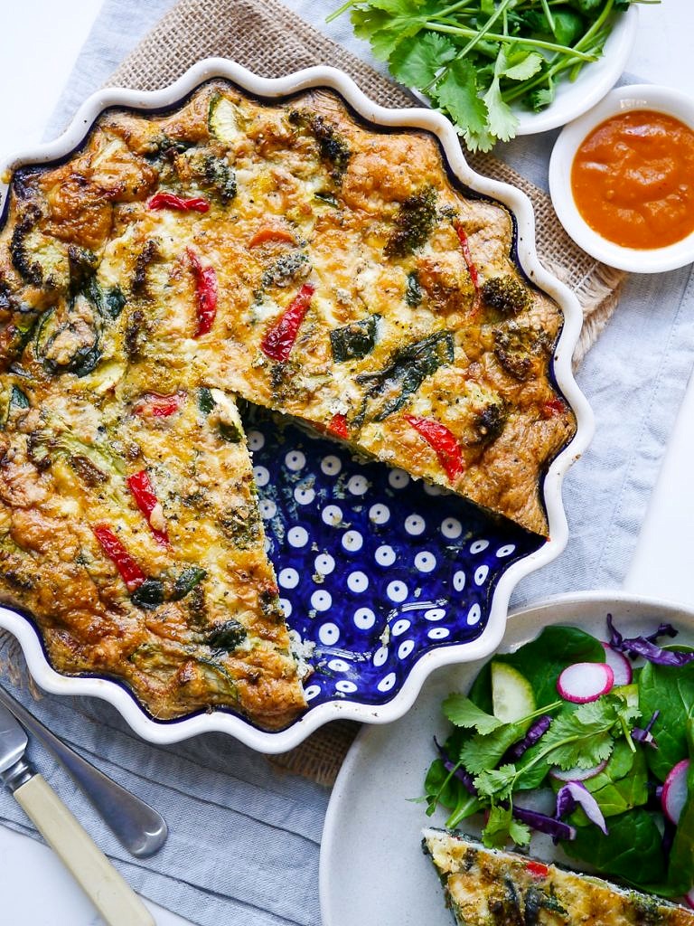 Pesto Vegetable Frittata in a blue pie dish