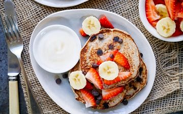 These Vegan Chocolate Chip Banana Pancakes are made gluten free with buckwheat flour, and only naturally sweetened. A healthy but indulgent breakfast!