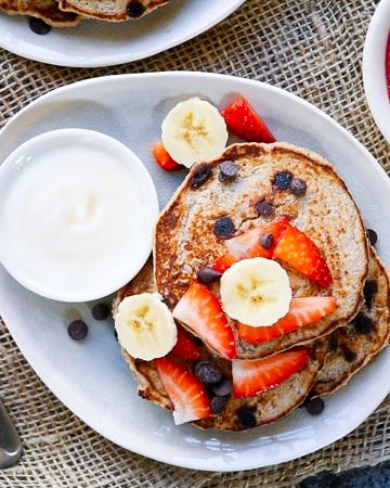 These Vegan Chocolate Chip Banana Pancakes are made gluten free with buckwheat flour, and only naturally sweetened. A healthy but indulgent breakfast!