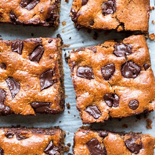 These easy blender chocolate almond butter bars are studded with dark chocolate chunks. Gluten free, grain free (paleo) and dairy free, a healthier dessert or indulgent snack!