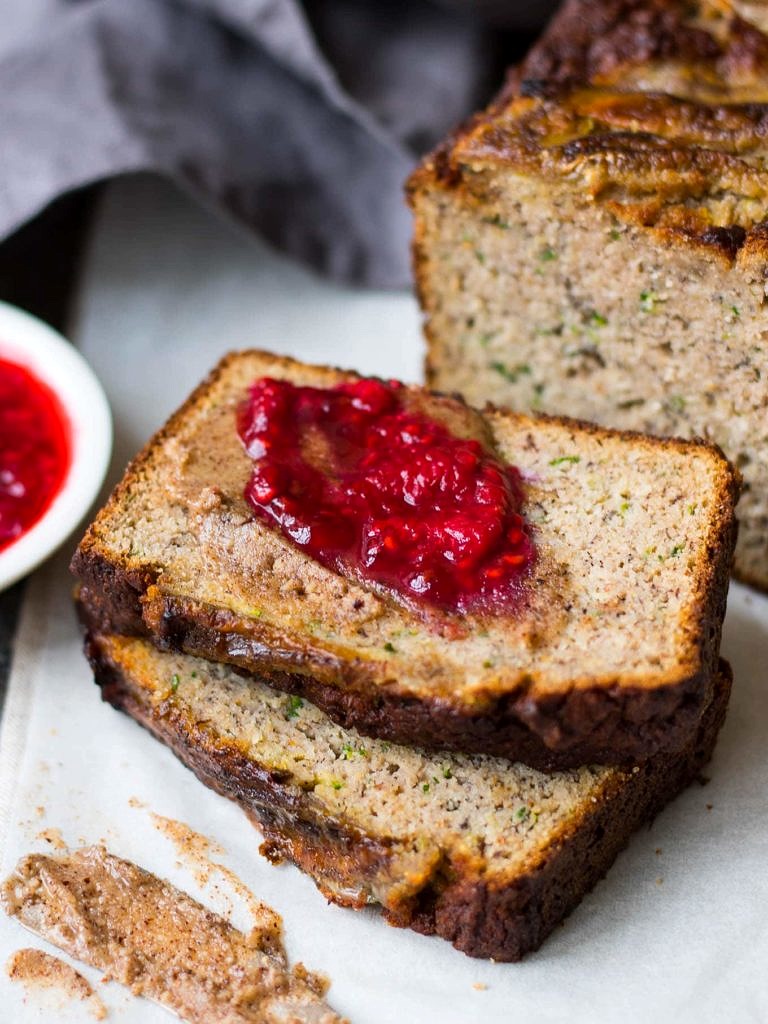 Grain free Zucchini Banana Bread is a low sugar loaf naturally sweetened with bananas and maple syrup. Dairy free, gluten free and paleo, enjoy a slice for breakfast or a healthy snack!