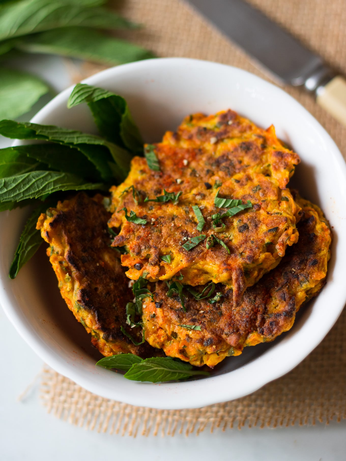 carrot fritters in a small white bowl