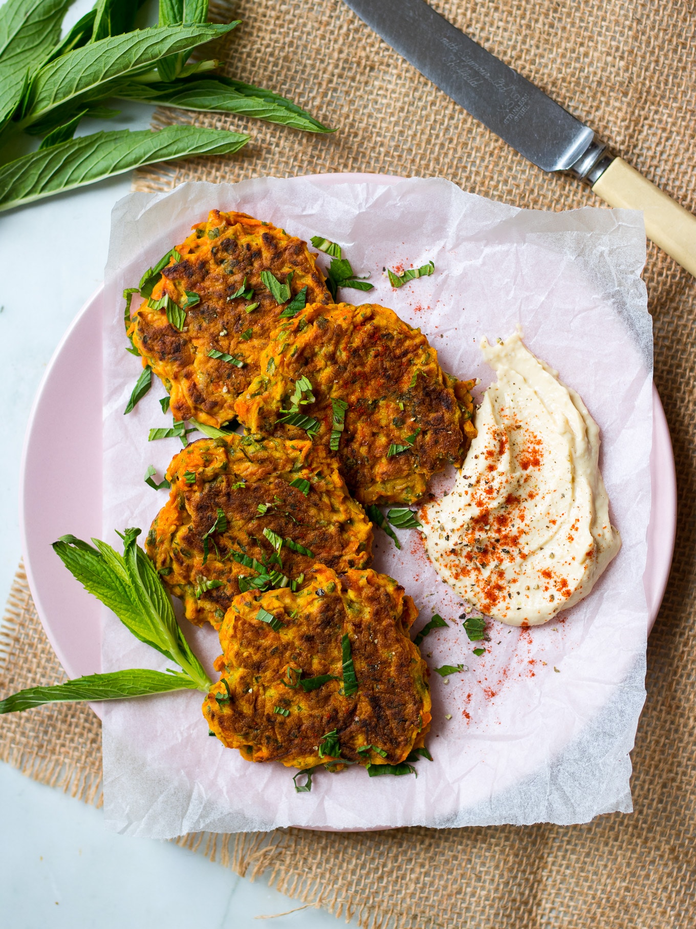 4 Ingredient Healthy Carrot Fritters {gluten free, dairy free, nut free} so simple and delicious! Served here with hummus. #vegetablefritters #glutenfree #healthy