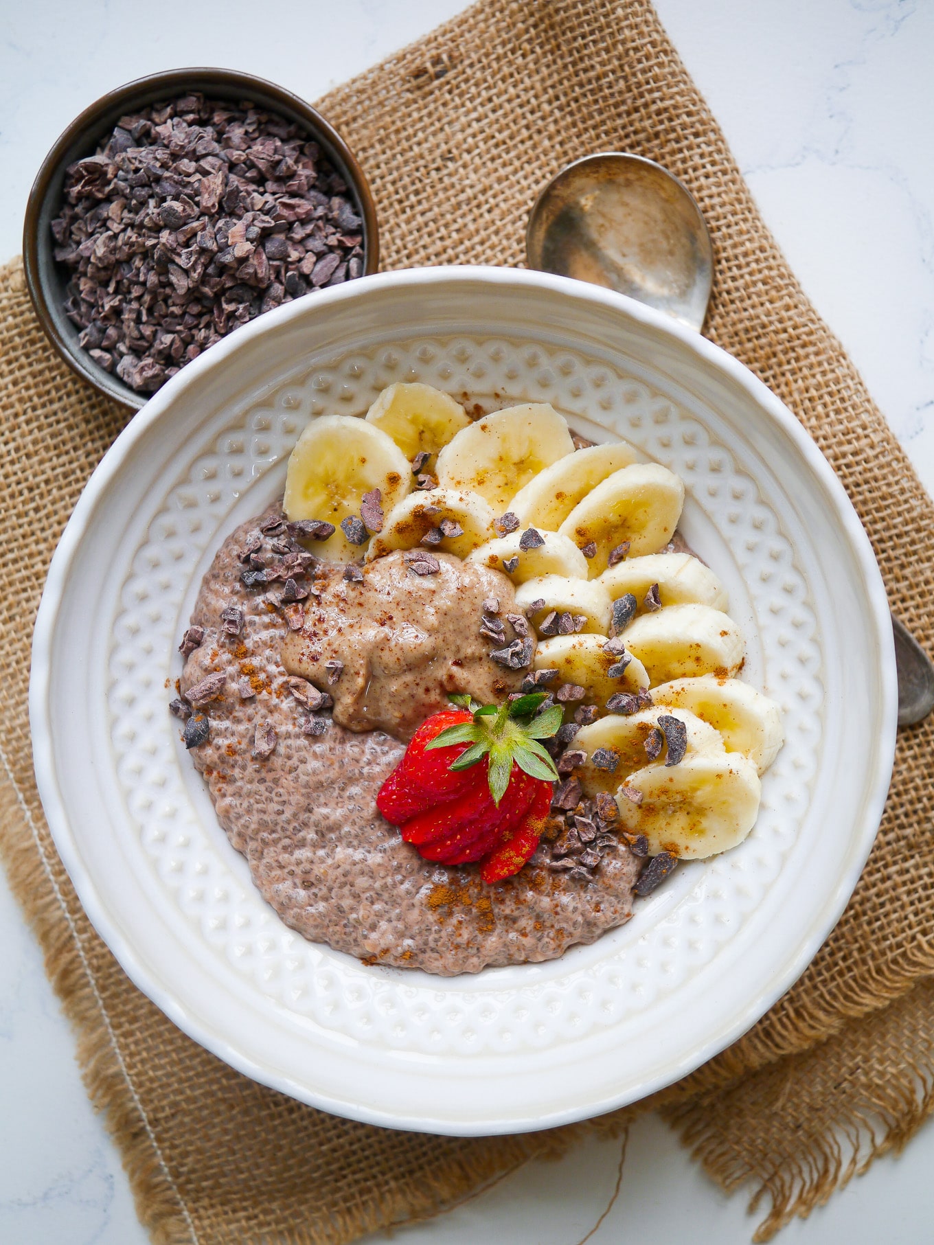 Easy chunky monkey chia pudding is a great healthy breakfast or snack; maybe even dessert! Cacao chia base, sweet banana, creamy peanut butter and crunchy cacao nibs. Gluten free, dairy free and grain free.