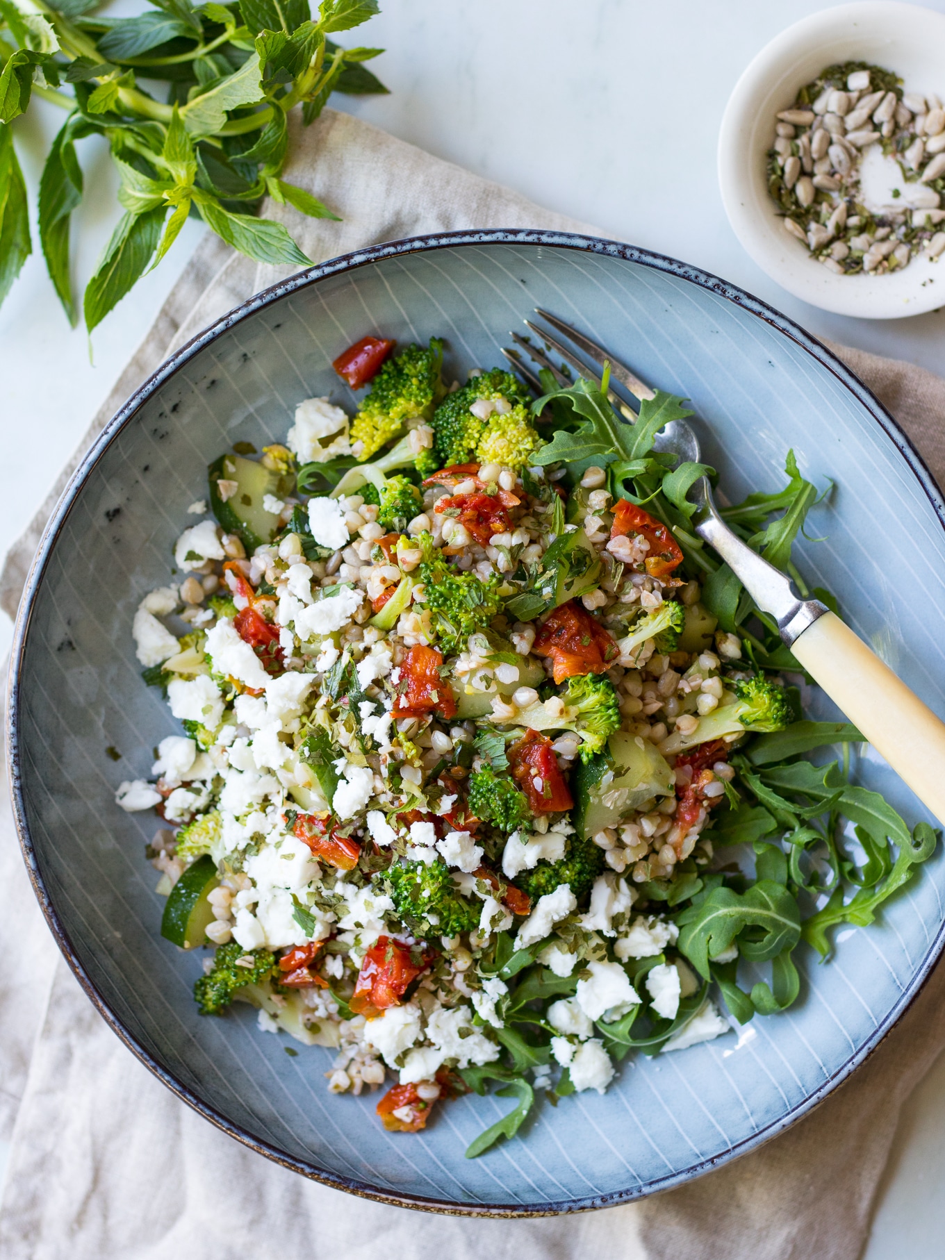 Healthy broccoli buckwheat salad with loads of fresh herbs and semi dried tomatoes for flavour! Feta optional. Easy, delicious, gluten free. #buckwheatsalad