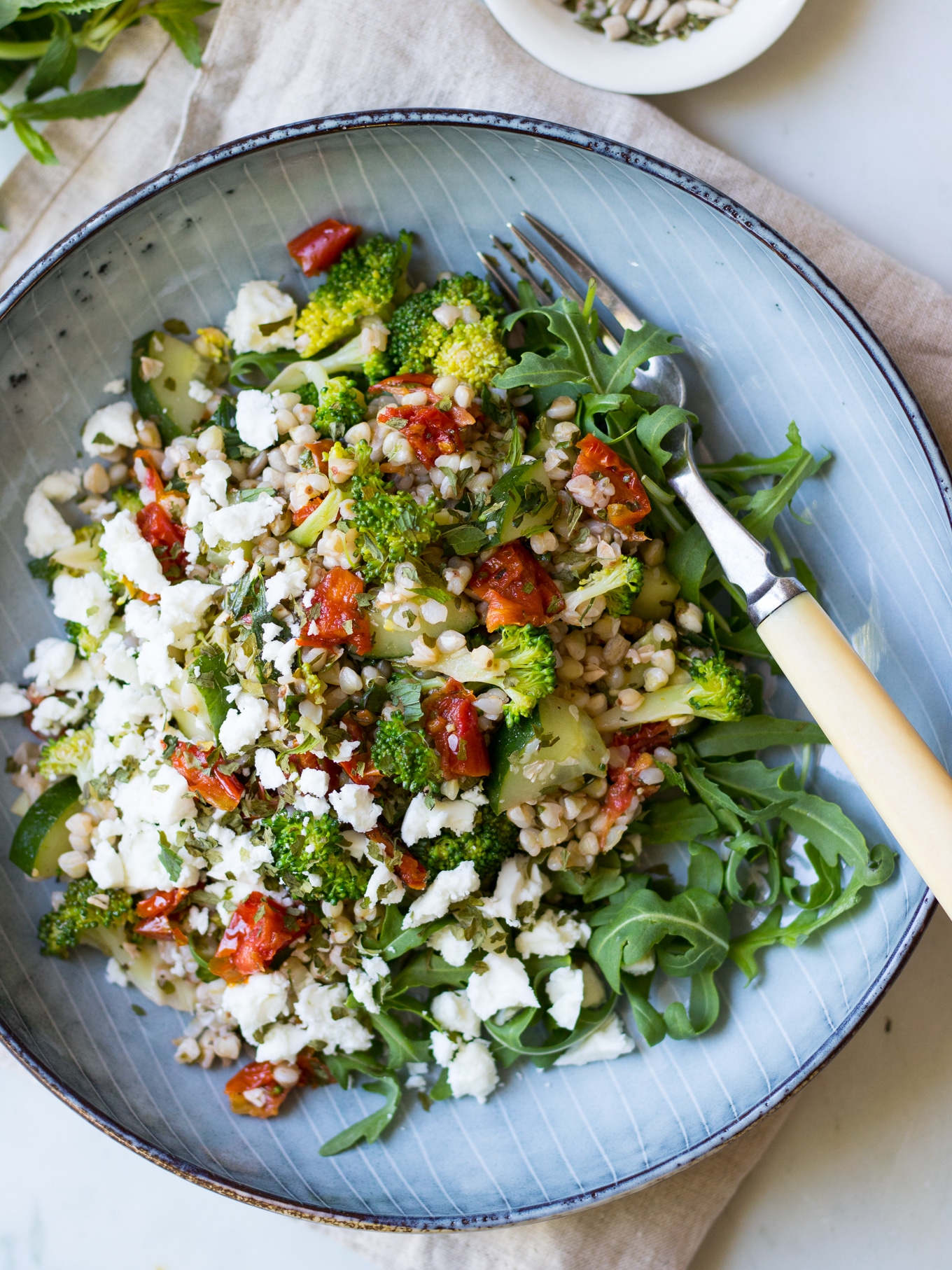 Broccoli Buckwheat Salad with loads of flavour from herbs, semi dried tomatoes and feta! Gluten free and super easy to make! #buckwheatsalad #glutenfree #healthy #buckwheatrecipes