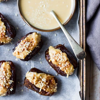coconut tahini stuffed dates and tahini dish on tray