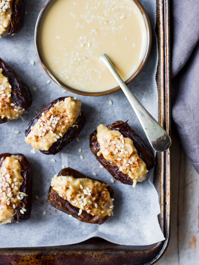 coconut tahini stuffed dates and tahini dish on tray