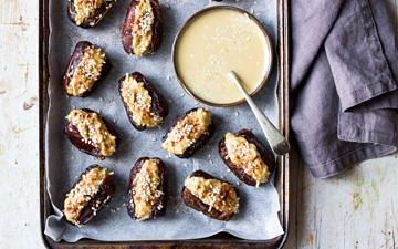 Coconut tahini stuffed dates on baking tray