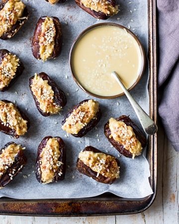 Coconut tahini stuffed dates on baking tray