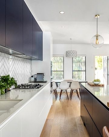 Terrace kitchen renovation (white and navy cabinets, subway tiles, kitchen island)