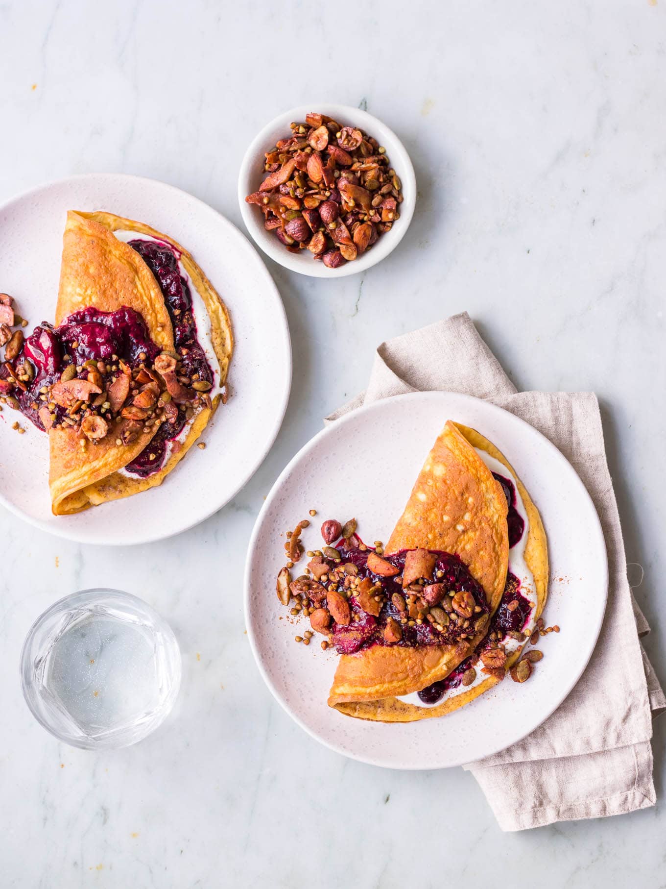 Sweet cinnamon omelettes with berry compote and granola topping
