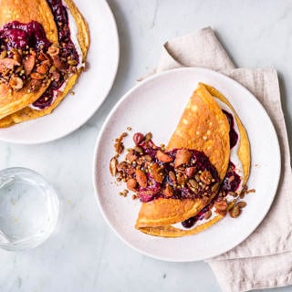 Sweet cinnamon omelettes with berry compote and granola topping