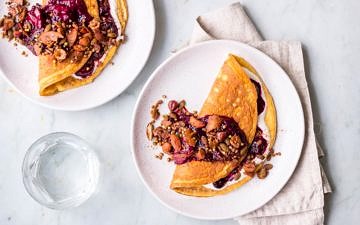 Sweet cinnamon omelettes with berry compote and granola topping