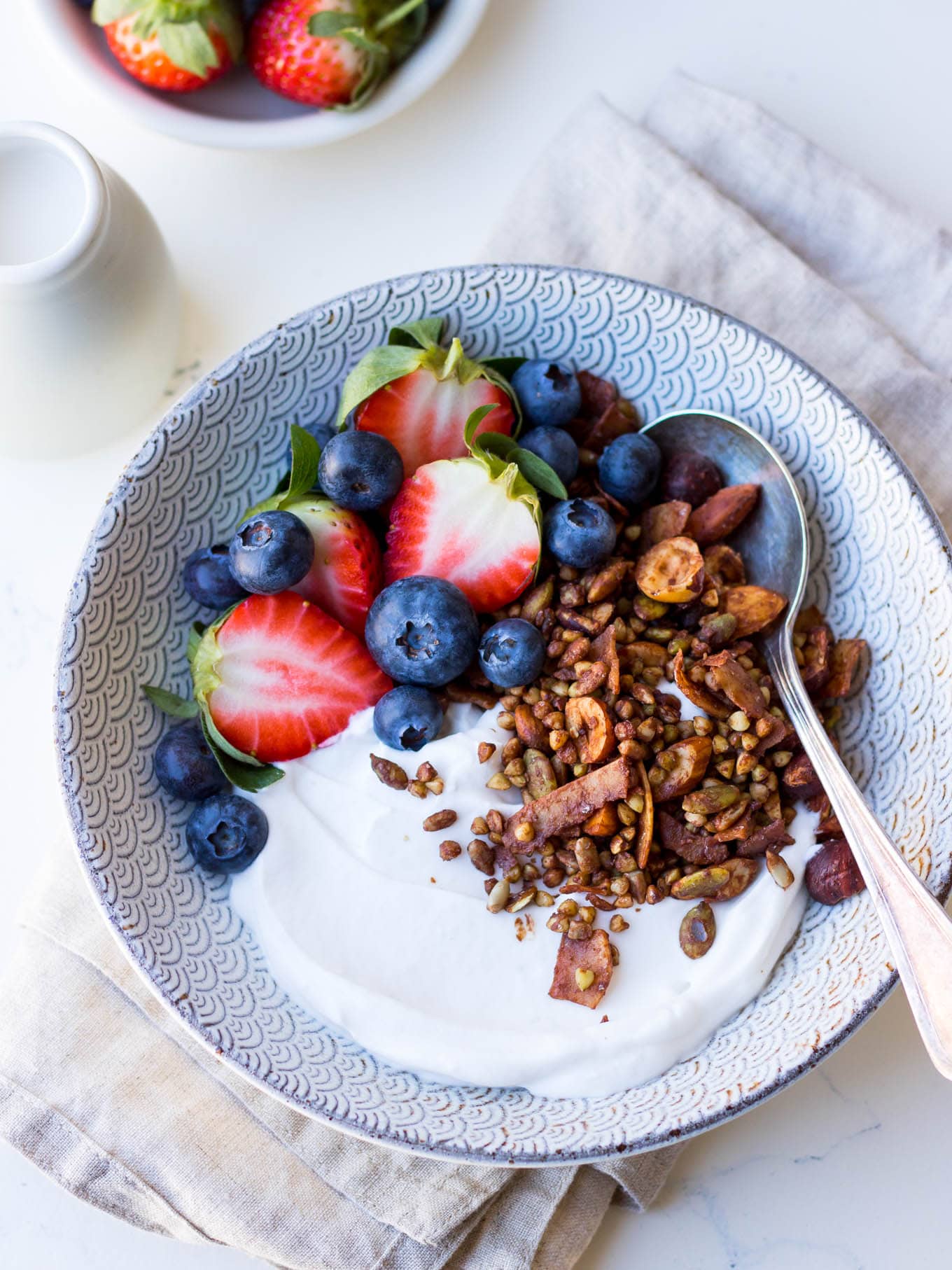 Gluten free cacao hazelnut granola with yoghurt and berries