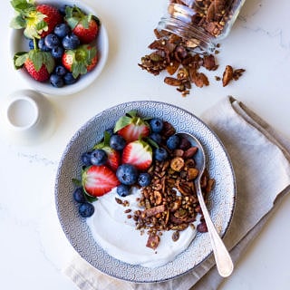 Gluten free cacao hazelnut granola with yoghurt and berries