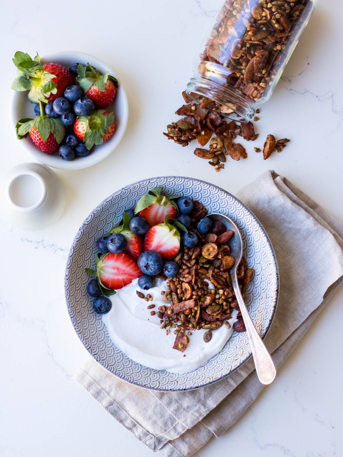 Gluten free cacao hazelnut granola with yoghurt and berries
