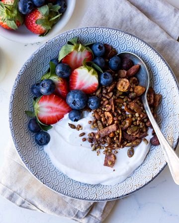 Gluten free cacao hazelnut granola with yoghurt and berries