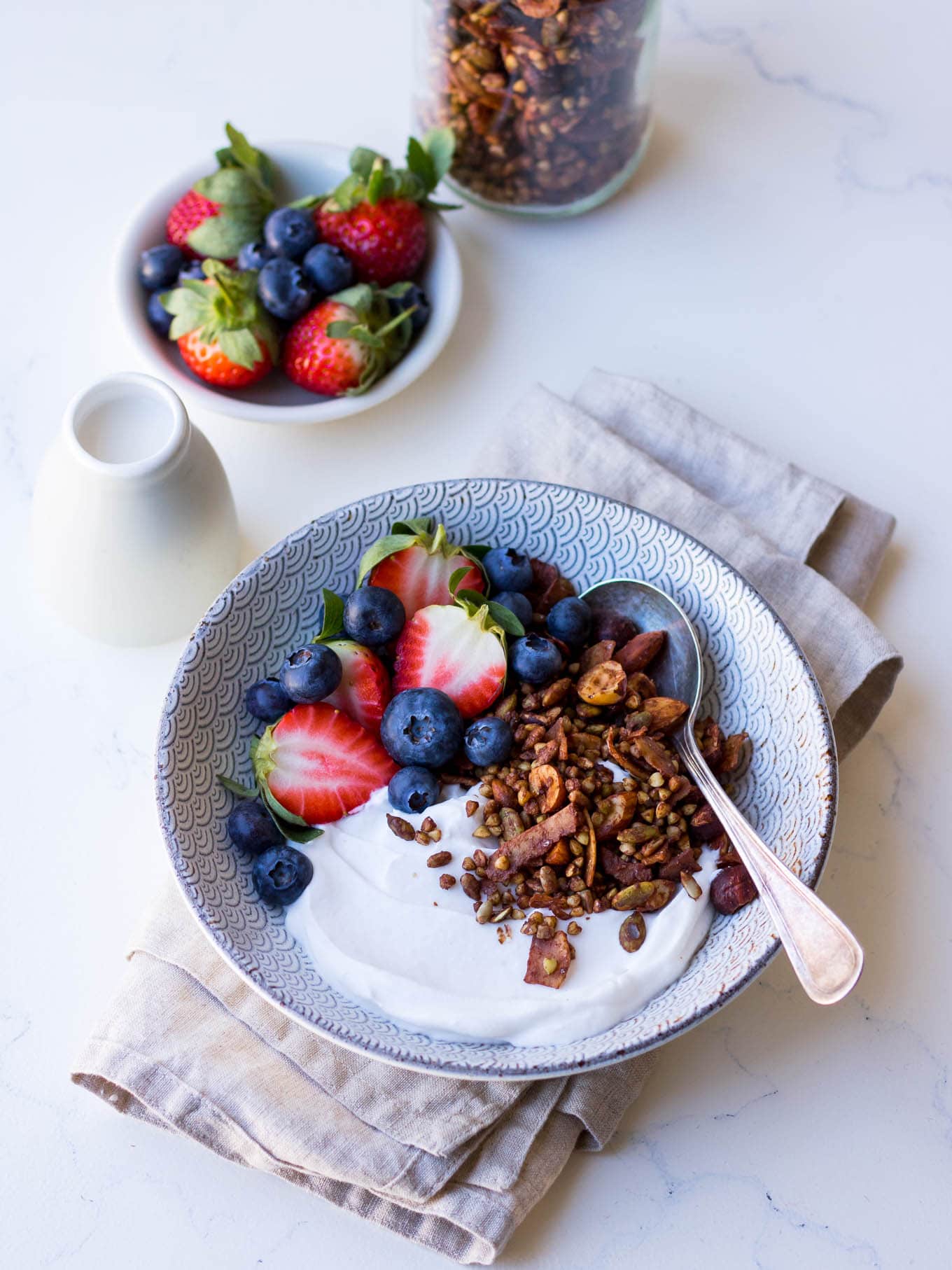 Gluten free cacao hazelnut granola with yoghurt and berries