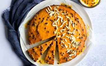 passionfruit yoghurt cake with passionfruit glaze and almonds