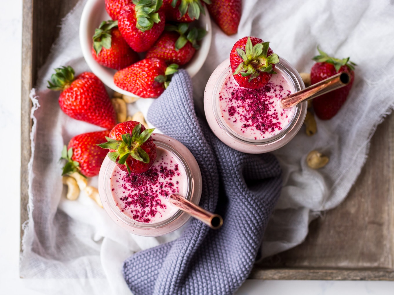 strawberry shortcake smoothie recipe, smoothies on a wooden tray