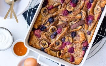 Baked French Toast topped with berries and banana slices