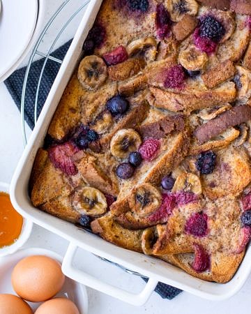 Baked French Toast topped with berries and banana slices