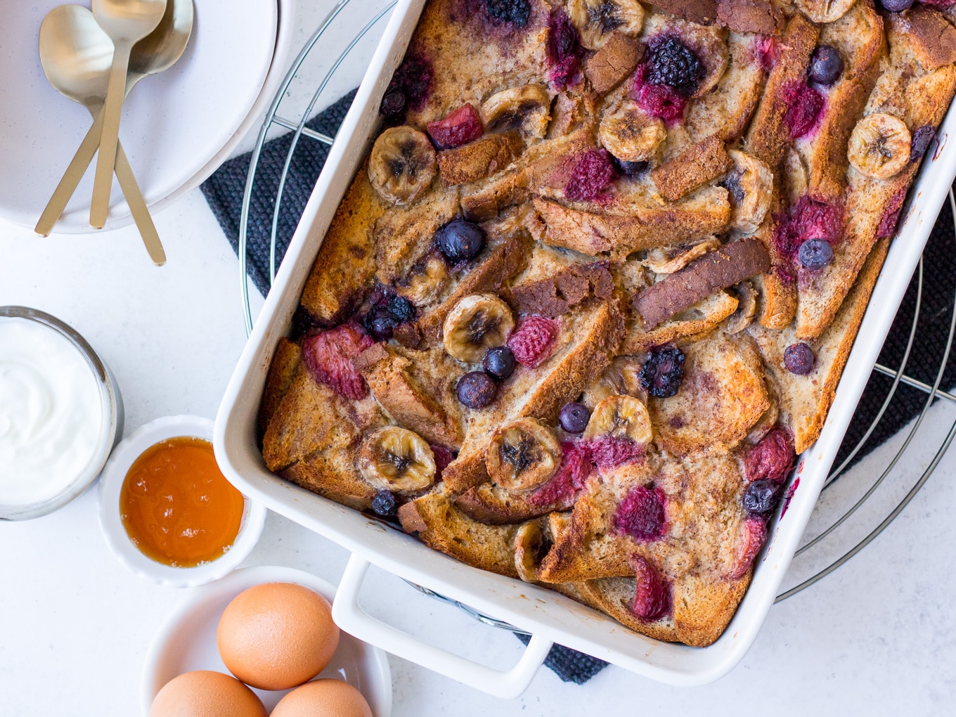 Baked French Toast topped with berries and banana slices
