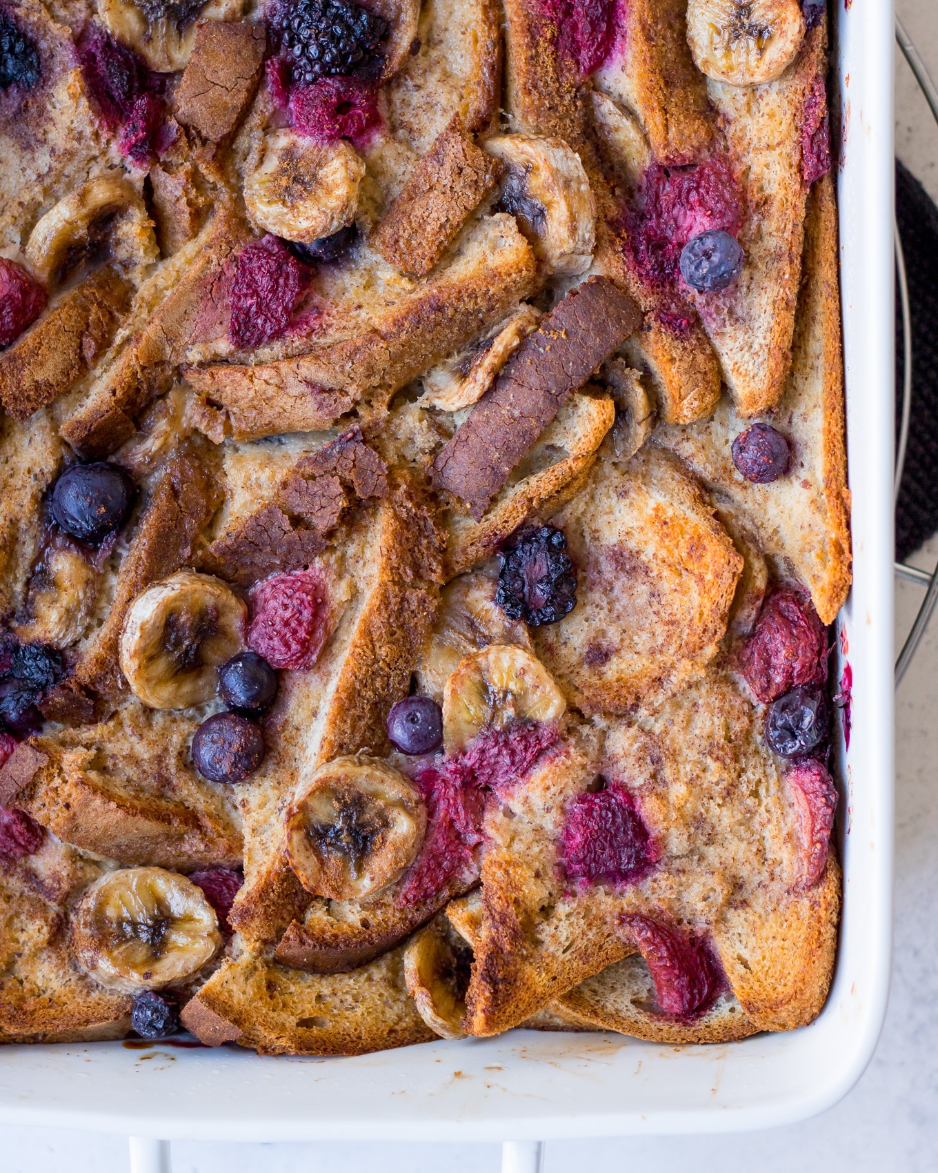 Baked French Toast topped with berries and banana slices