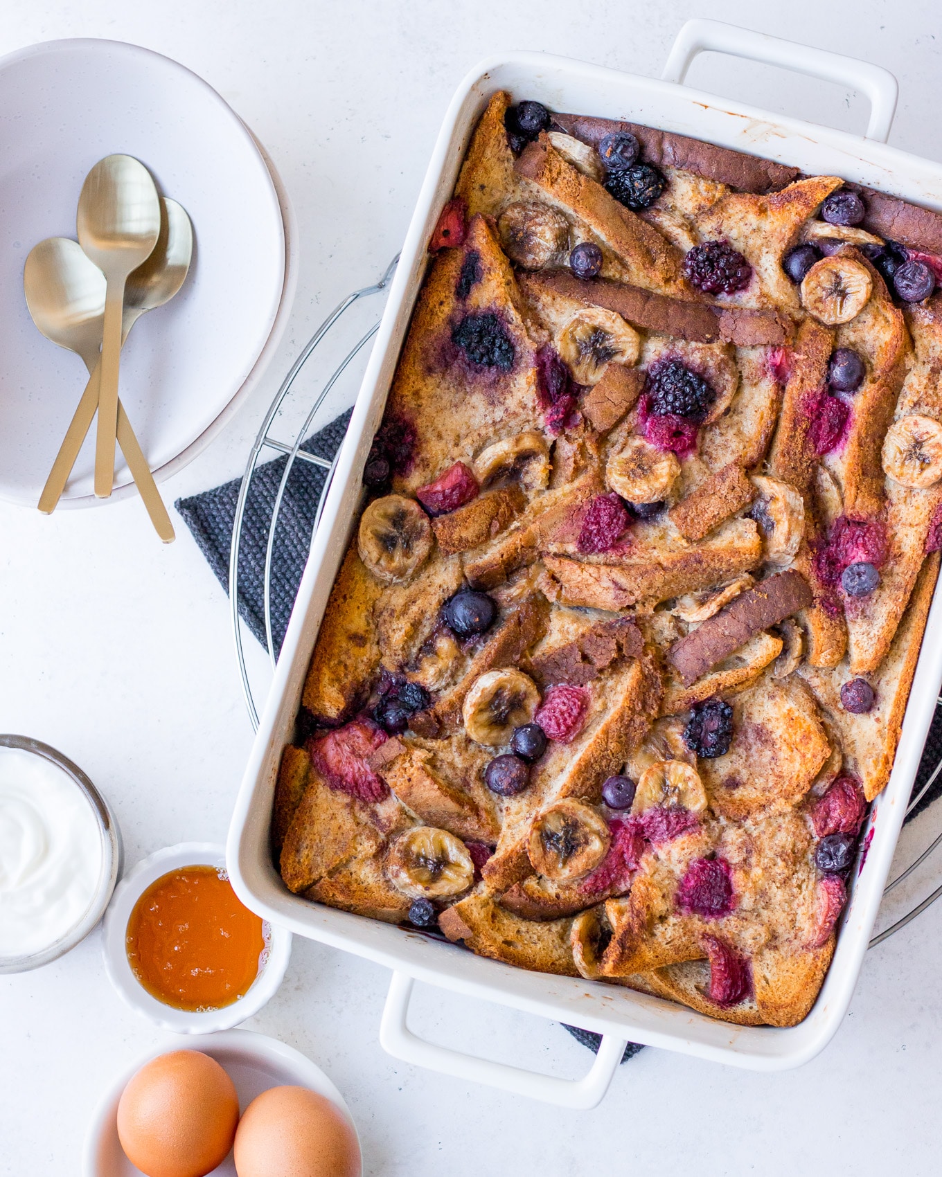 Baked French Toast topped with berries and banana slices