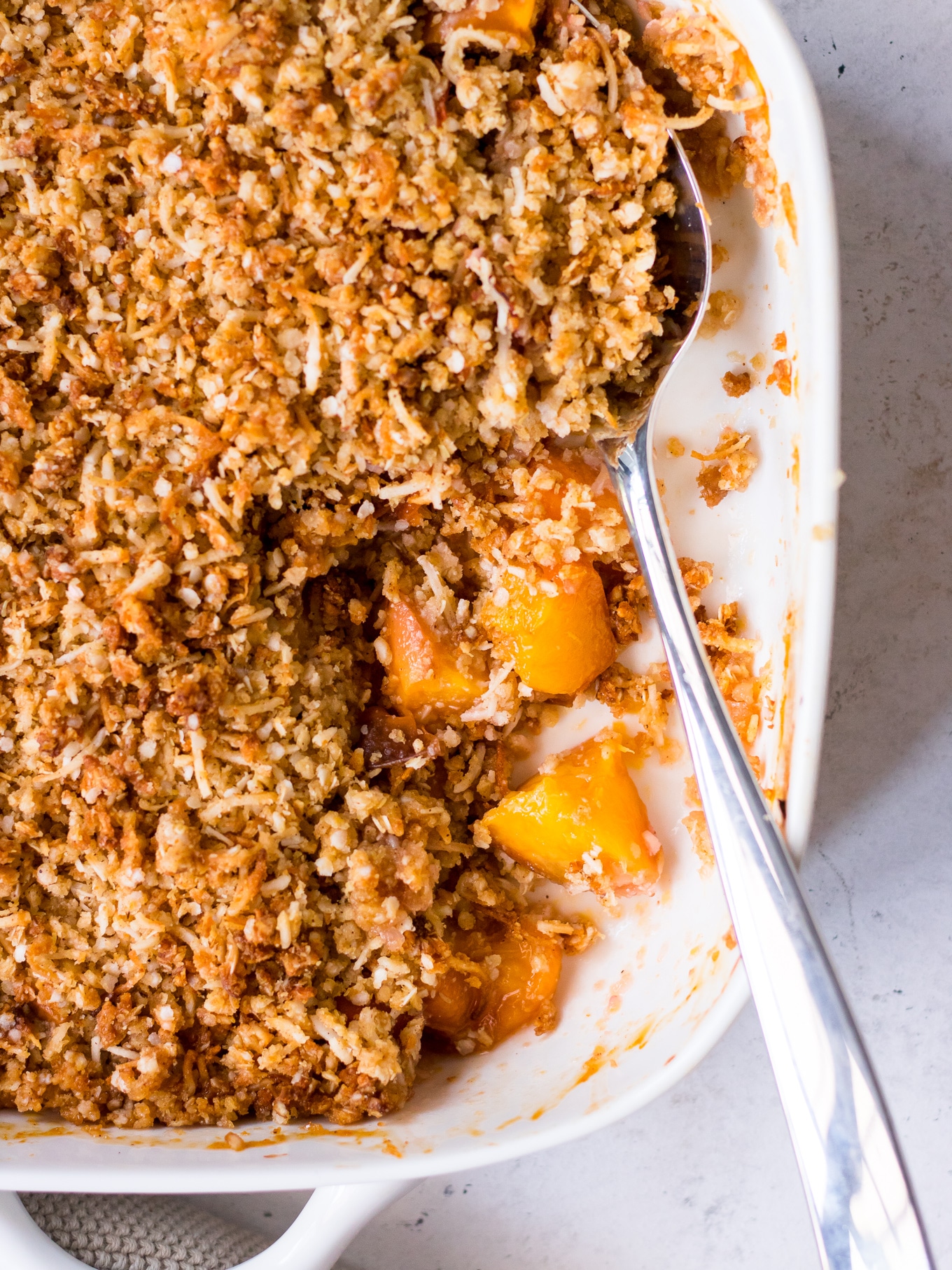 Close up of gluten free crumble topping made with quinoa flakes and coconut