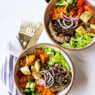 Turkey Apple Bean Burgers in ceramic bowls with salad