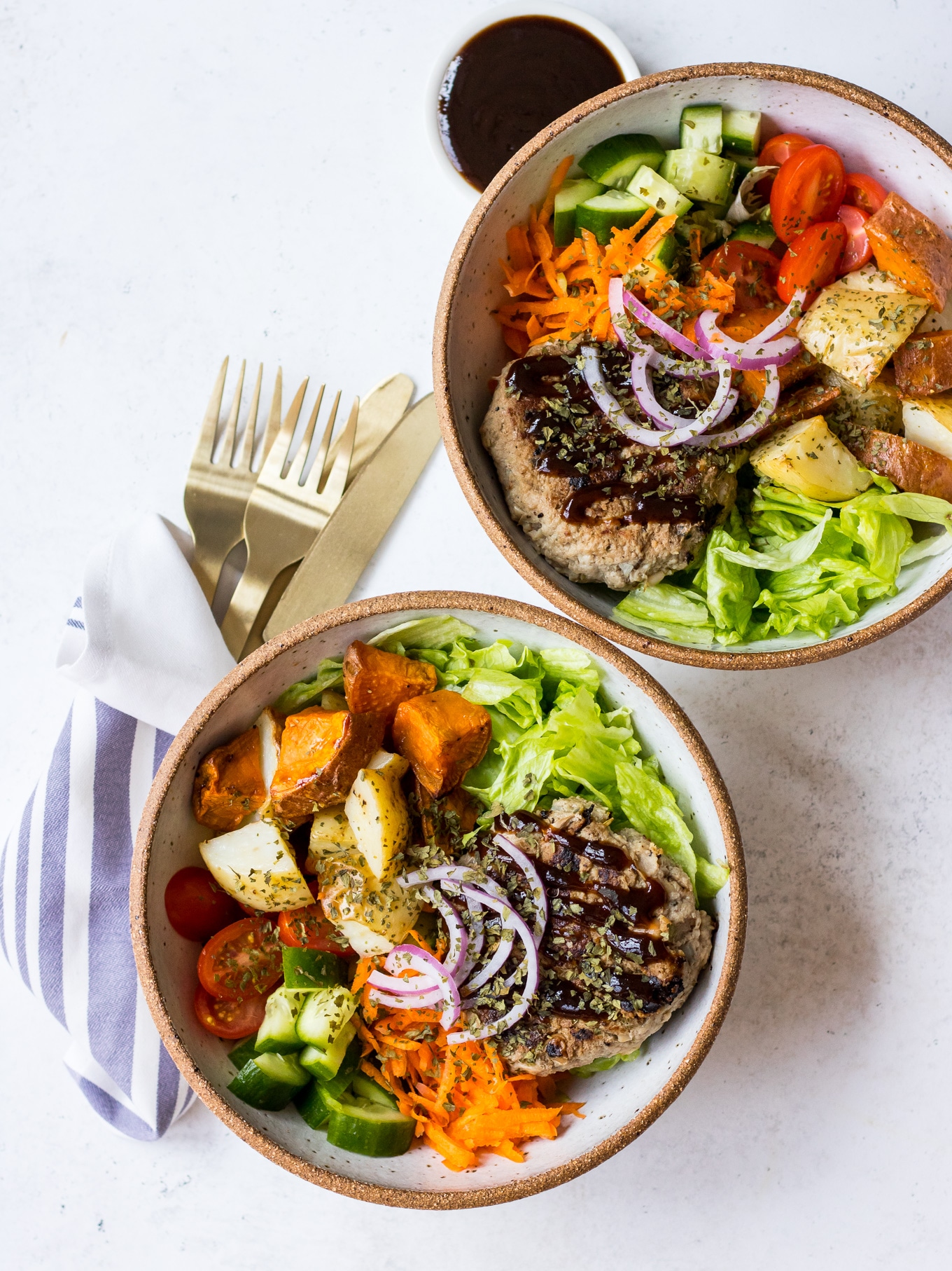 Turkey Apple Bean Burgers in ceramic bowls with salad
