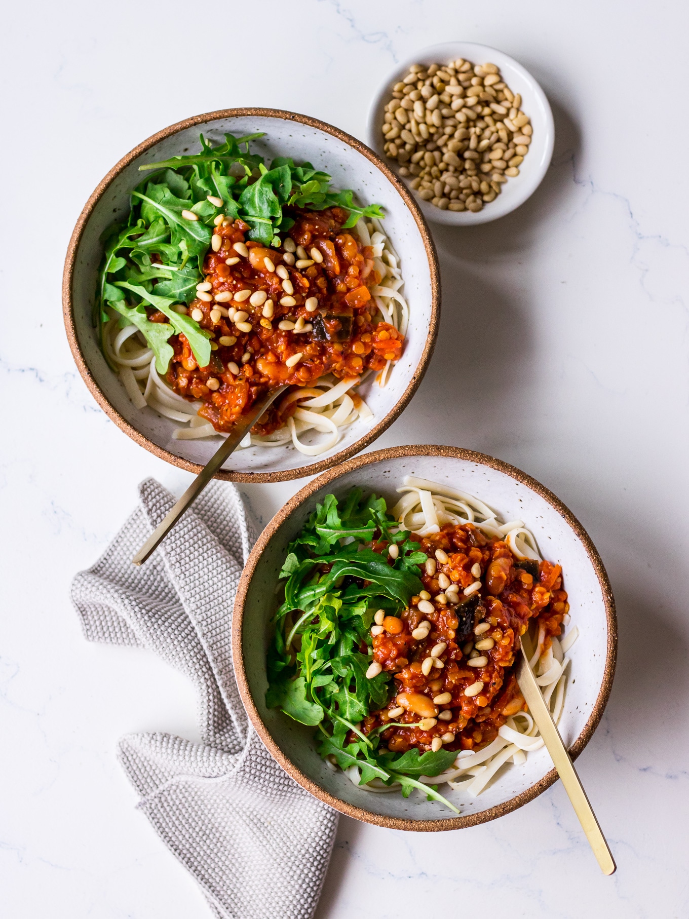Two bowls of vegan red lentil eggplant bolognese sauce
