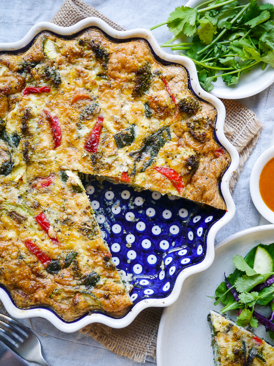 Blue ceramic pie dish with vegetable frittata